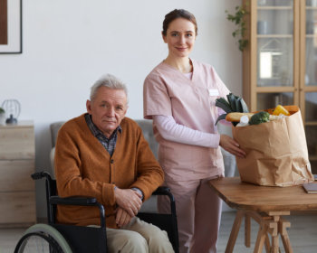 caregiver holding a bag of groceries