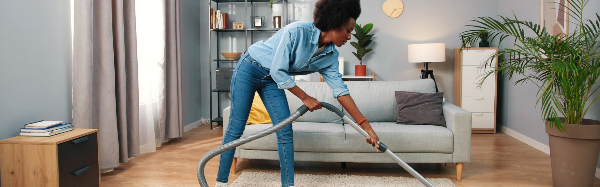 woman vacuuming the floor
